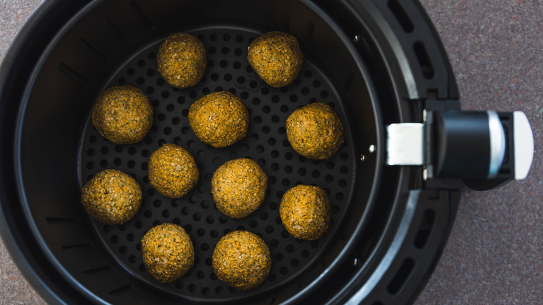 falafel balls in an air fryer basket