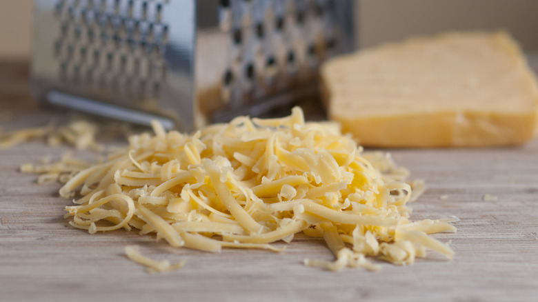 grated parmesan on a wooden table