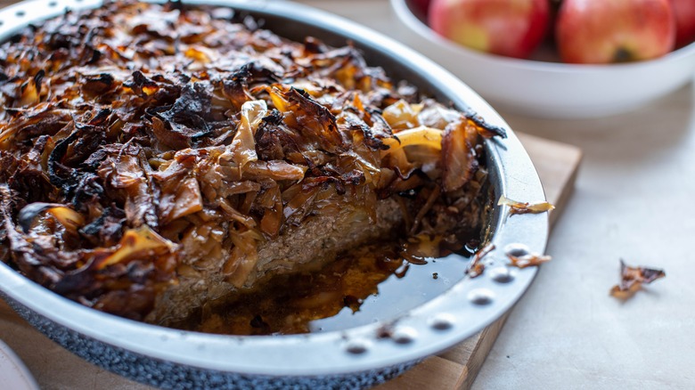 meatloaf in a pan with apples