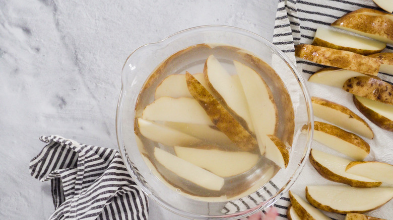 Cut potatoes soaking in water.