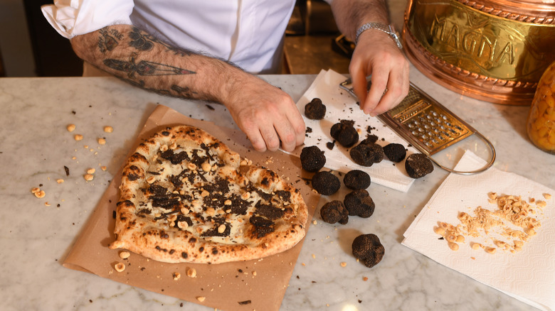 Chef grating fresh truffles