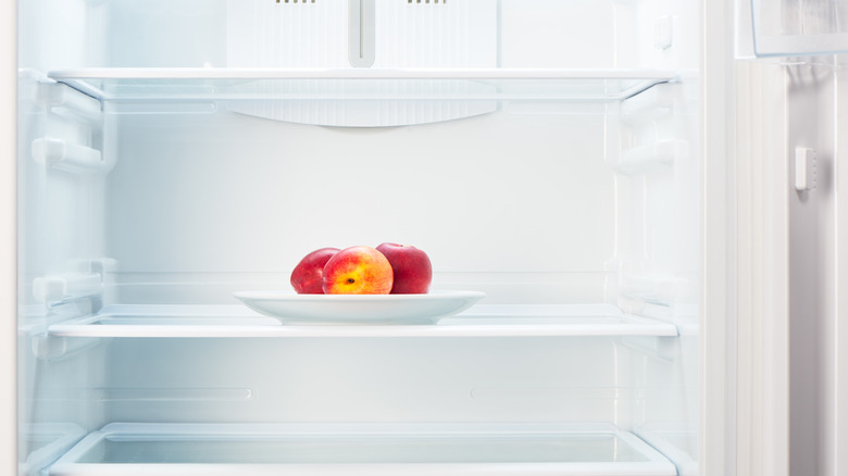 Fresh peaches in a refrigerator
