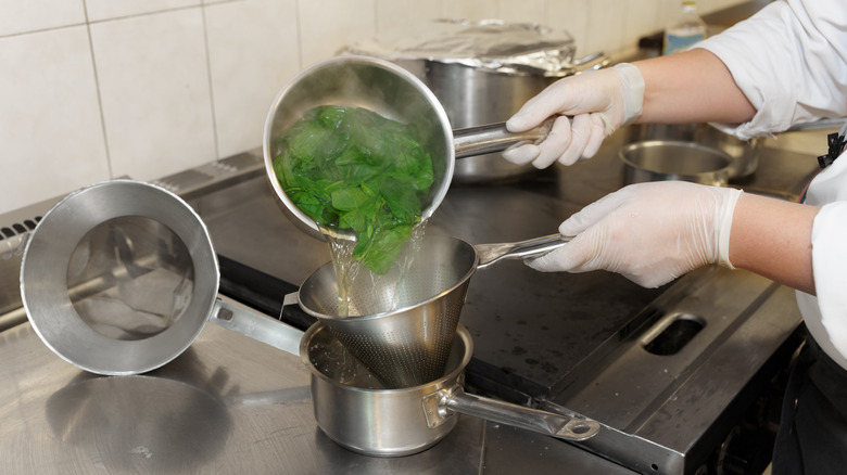 Blanching spinach in professional kitchen