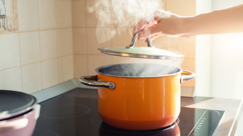 an enamel pot of boiling water