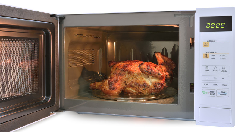 microwave oven with roast chicken