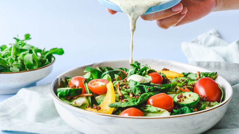 Dressing poured on salad