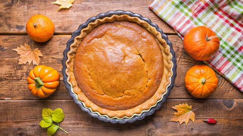 rustic pumpkin pie on wooden table