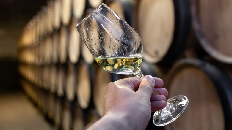 chardonnay on a oak barrel background