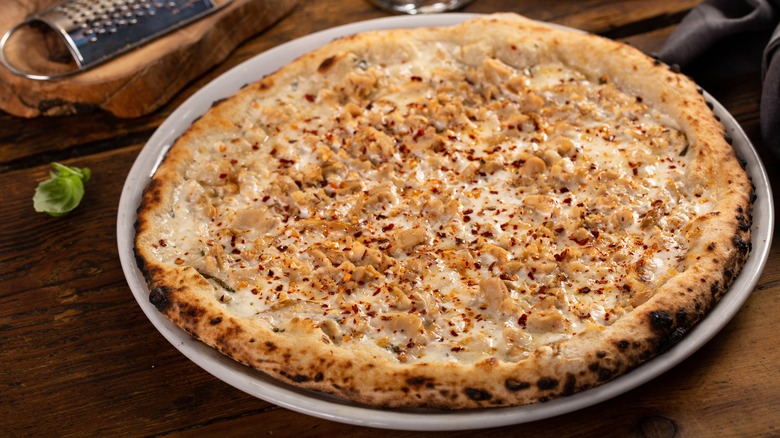 White clam pizza on table