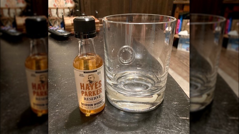 Small bottle of Hayes Parker Bourbon and glass