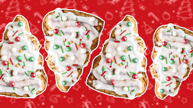 Four Christmas tree-shaped cinnamon rolls next to each other