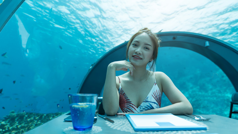 Woman dining underwater