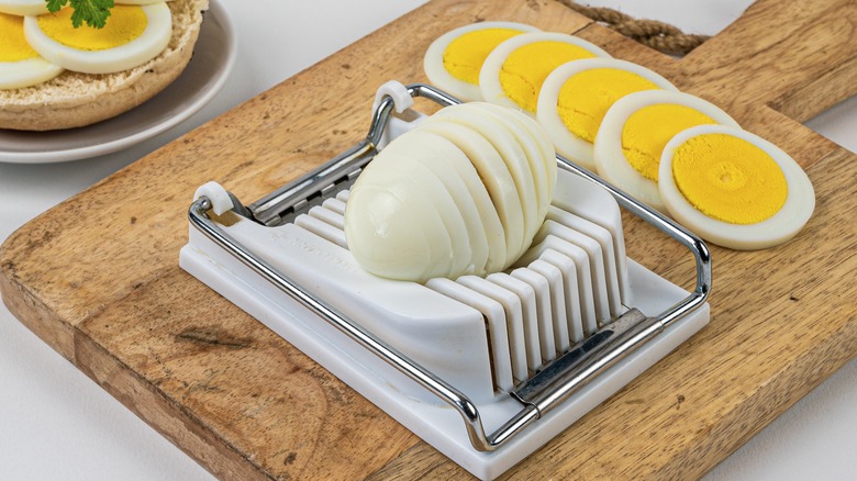 Egg slicer slicing hard boiled eggs