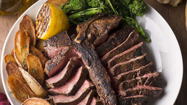 steak with roasted potatoes and broccoli