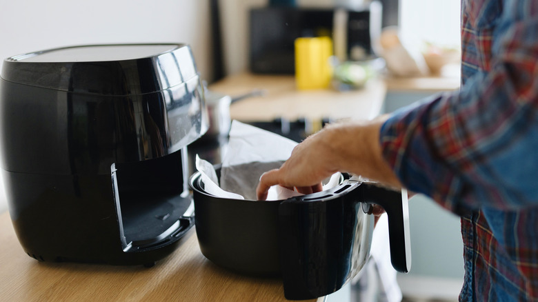 Adding parchment paper to air fryer