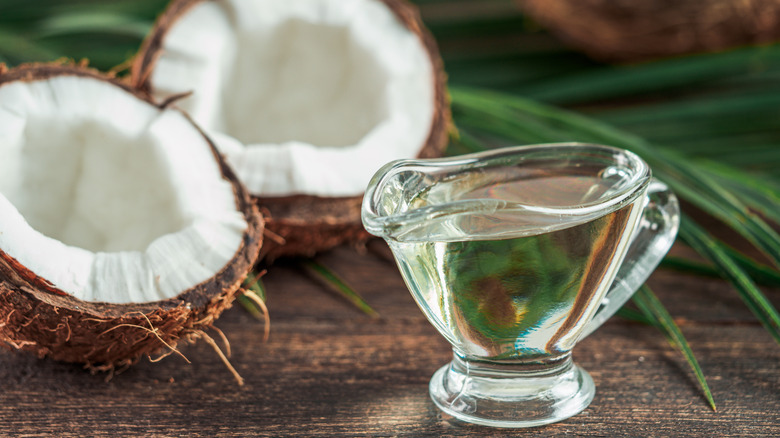 coconut oil next to coconuts