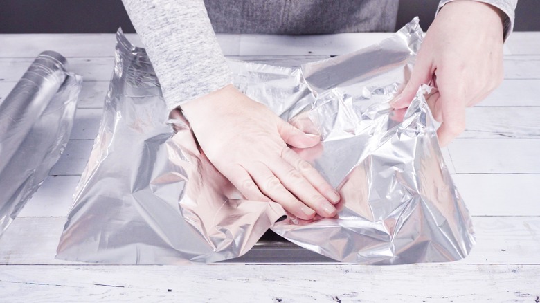 The Aluminum Foil Hack To Try When Your Baking Pan Is Too Big For Your Dish