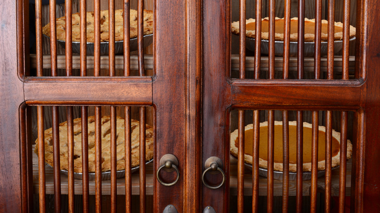 antique pie safe with pies inside