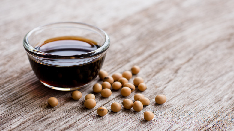 Glass bowl of soy sauce