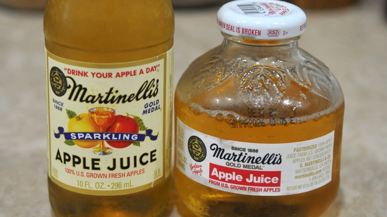 Two Martinelli's apple juice bottles