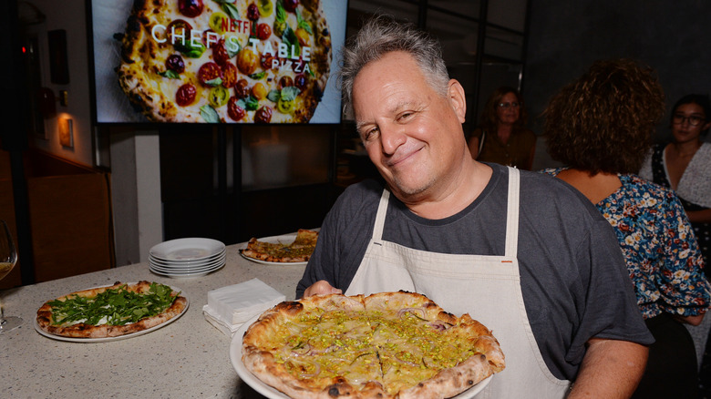 Chris Bianco holds pizza