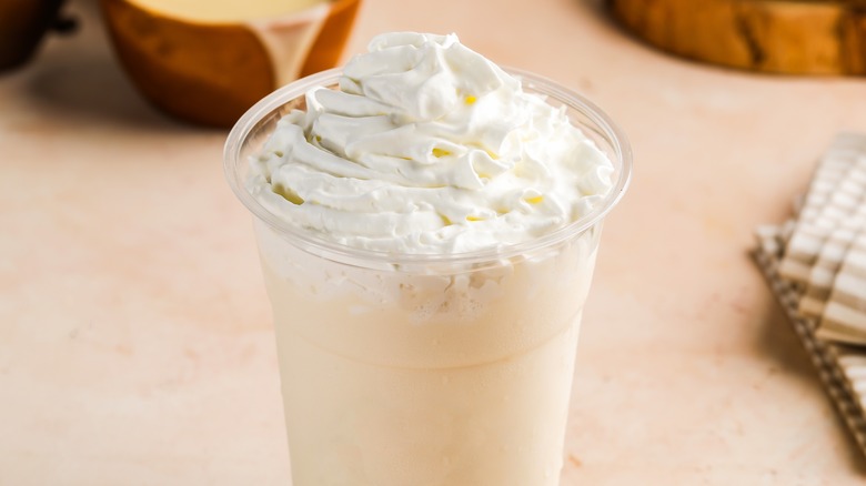 A vanilla milkshake with whipped cream