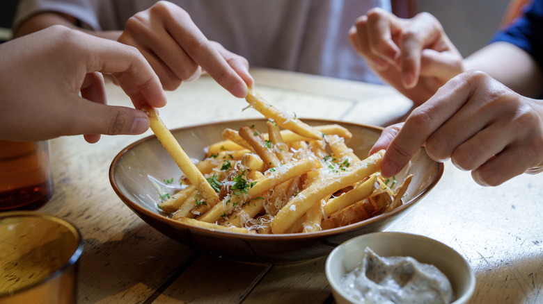 seasoned french fries in serving dish 