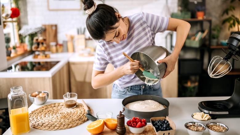 happy woman baking in kitchen