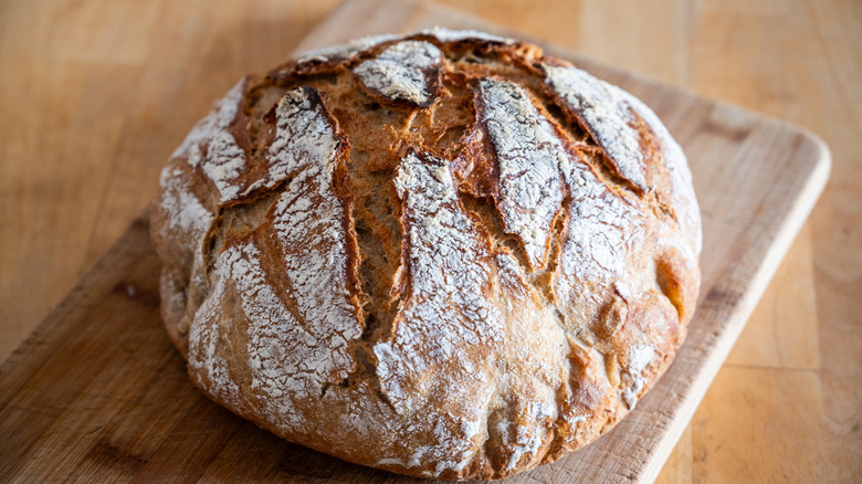A round of artisanal bread on a board