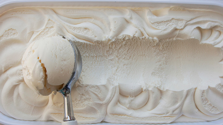 Scooping vanilla ice cream