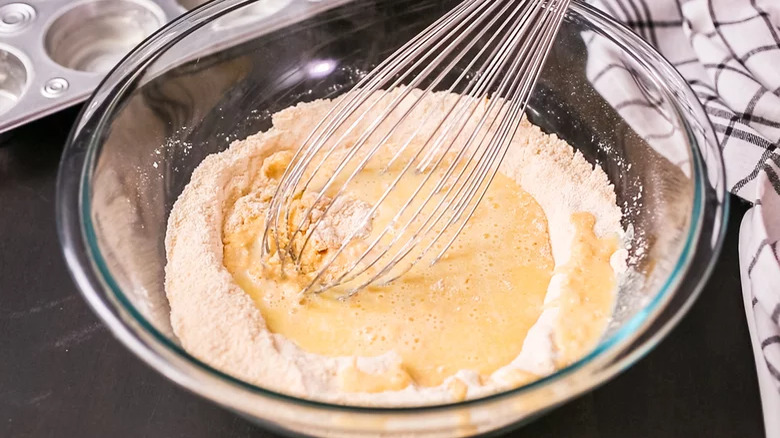 stirring cornmeal into crepes batter