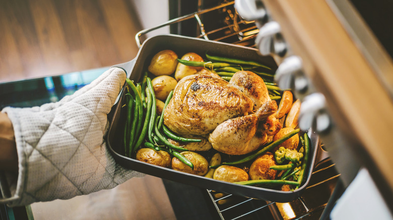 Roasted chicken and veggies in oven