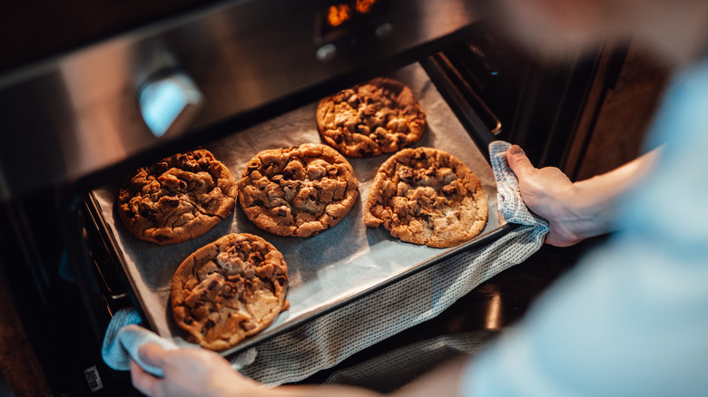 Tray of cookies pulled out of oven