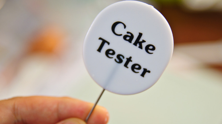 Cake tester in someone's hand