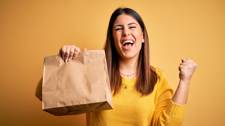 woman holding paper bag