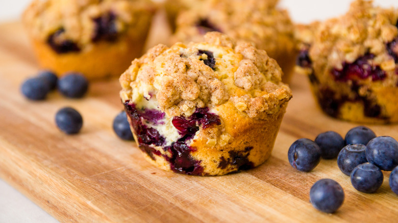 blueberry muffins on wood