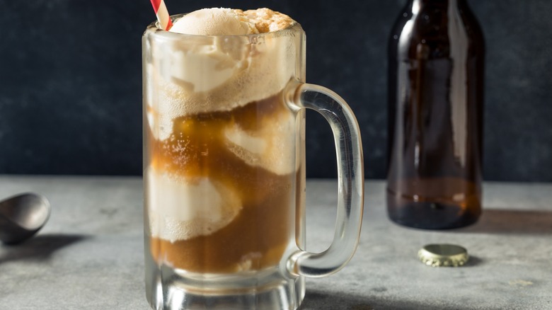 A root beer float and a glass bottle