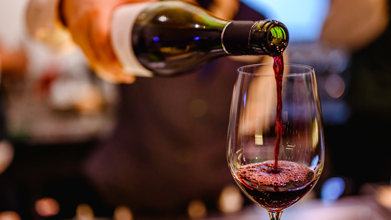 Pouring pinot noir into glass