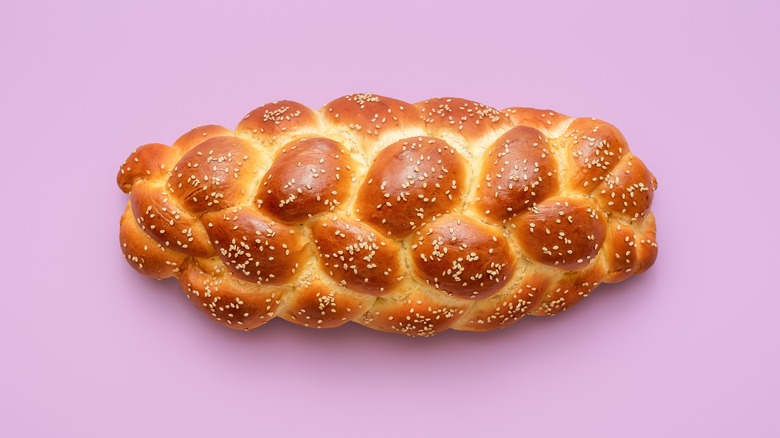 Challah bread on purple background