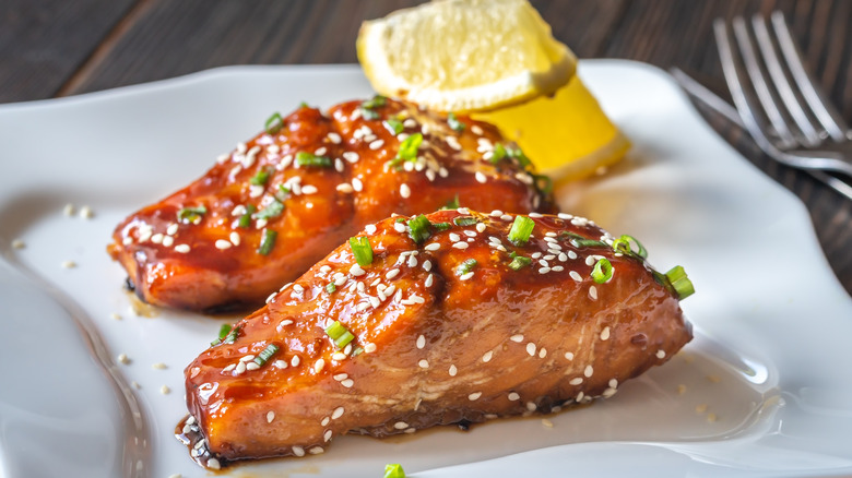 two salmon pieces with teriyaki marinade