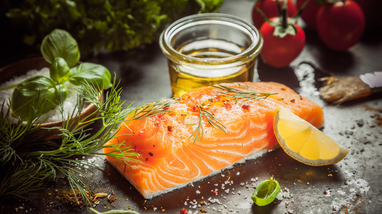 Raw salmon fillet with herbs