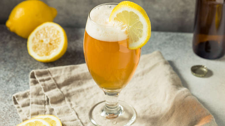 Glass of shandy and lemons