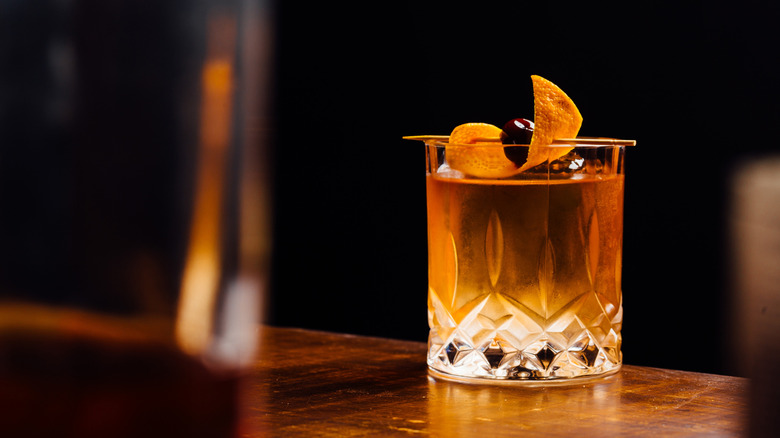 old fashioned cocktail with orange peel