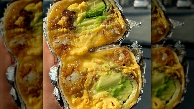 cheesy breakfast burrito with avocado