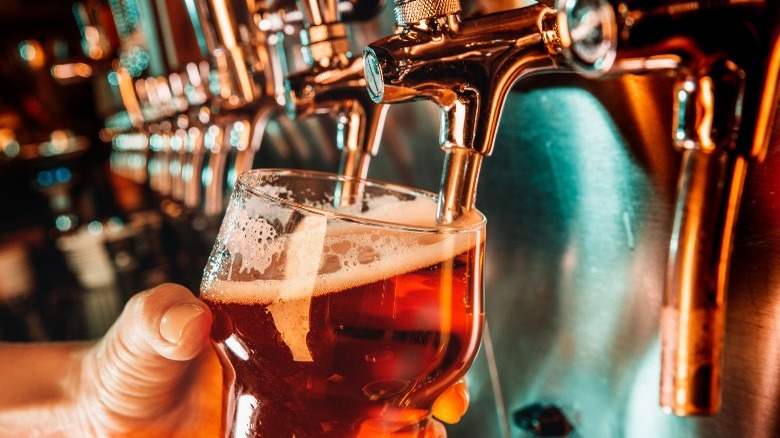 Pouring a beer at a tap