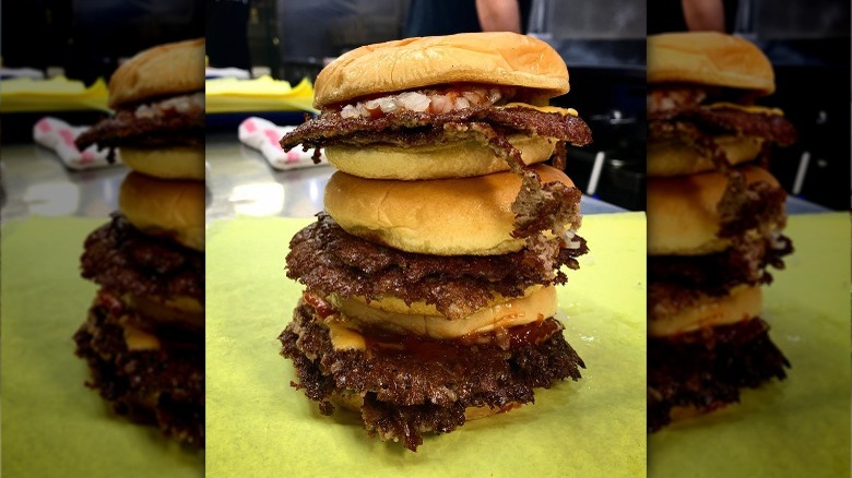 Three stacked smash burgers