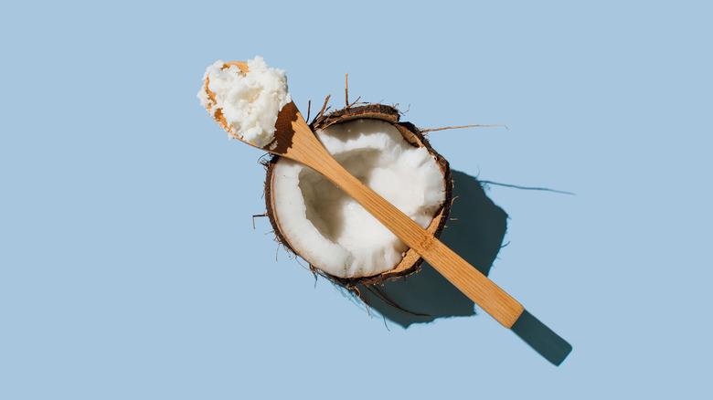 spoon of coconut oil on coconut