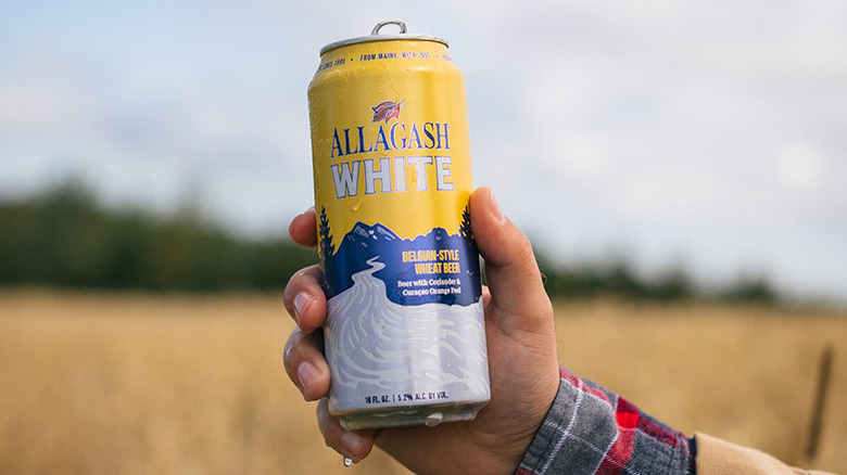 Allagash White can in hand