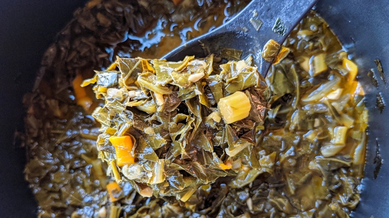 collard greens heating in a pan