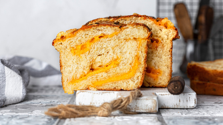 sliced loaf of cheddar cheese swirled bread